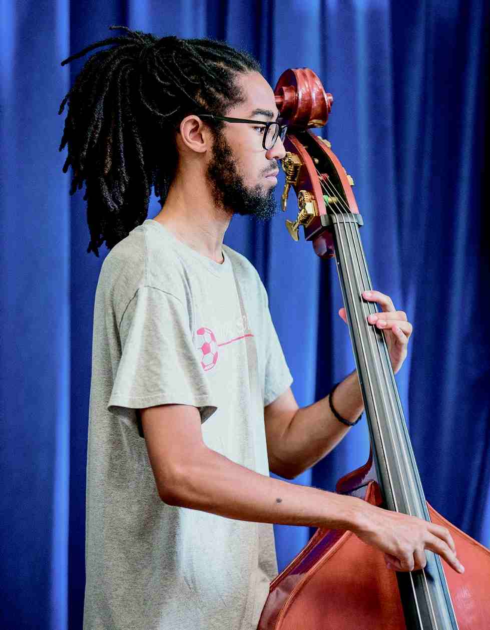 student playing bass